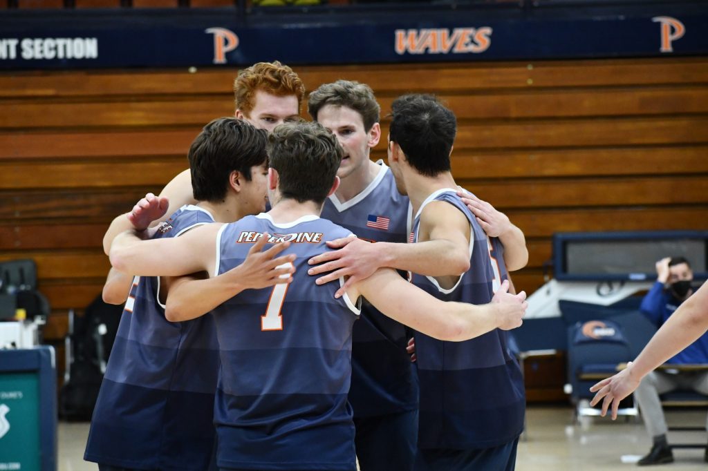 The team huddles during a game in the 2021 season. Driven by the shortcomings of past season, the Waves are returning with a bigger drive this season.