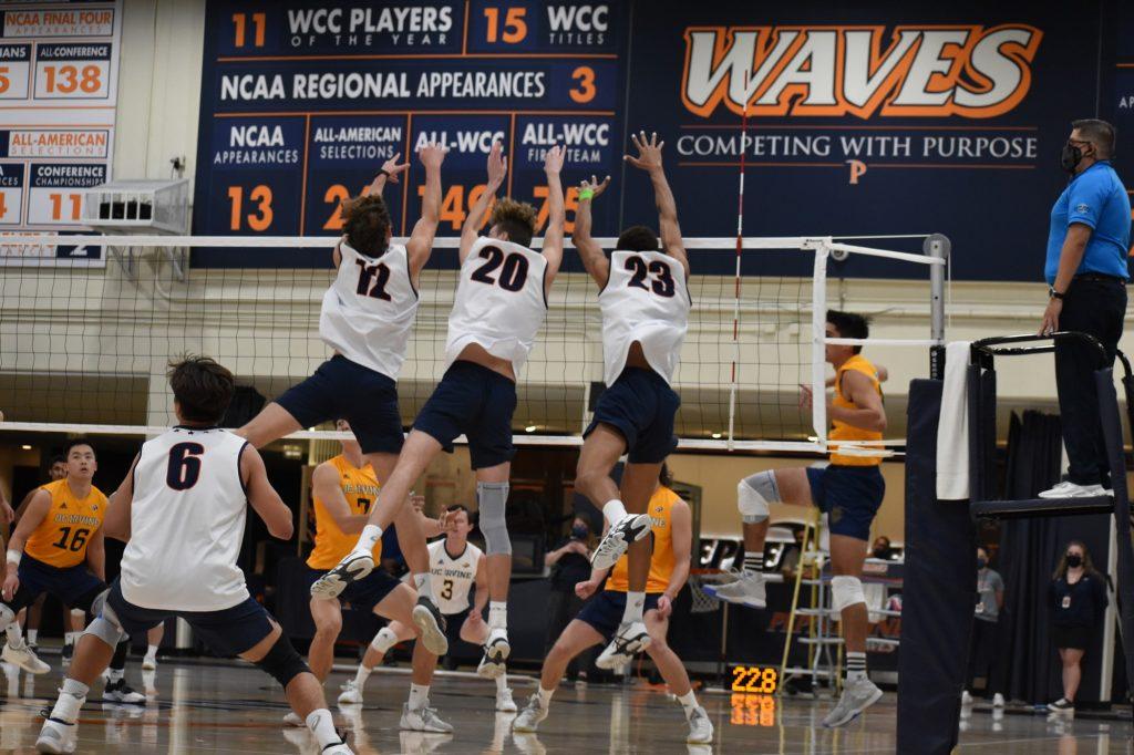 Redshirt sophomore Jacob Steele joins graduate student middle blocker Austin Wilmot and graduate student outside hitter Jaylen Jasper at the net for a block during their match against UC Irvine in Firestone Fieldhouse on Feb 9. The Waves utilized a strong defense to keep the lead in the second set.
