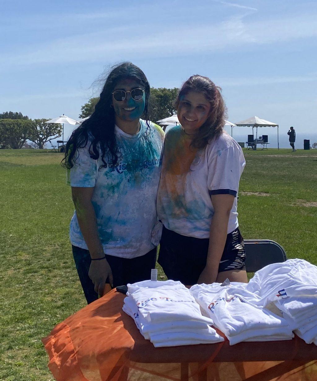 Bal and Chhabra greet students at the entrance and hand out shirts and colored powders. The two E-board members were excited to share their culture with the Pepperdine community. Photo by Christina Buravtsova