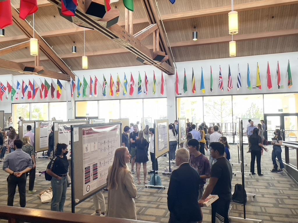 Students share their research posters with the Pepperdine community in the Waves Café. Researchers said their faculty mentors played a big role in putting together their presentations. Photo by Liza Esquibias