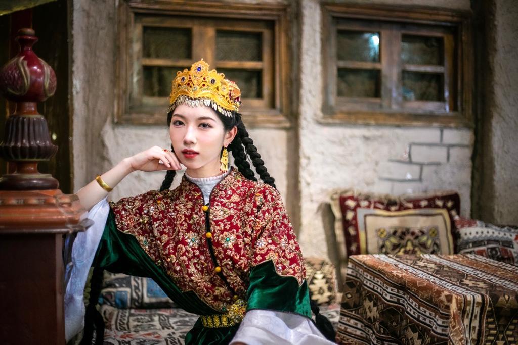 Sun wears a traditional Uyghur costume. Sun said her Chinese heritage is one of her core identities.