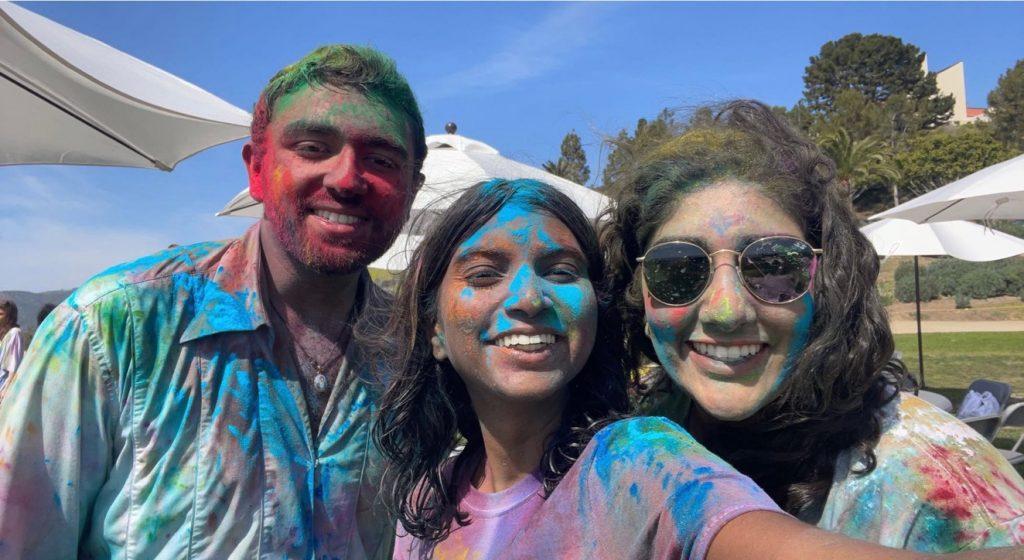 ISA Vice President Sahej Bhasin (from left), ISA Creative Director Rebekah Daniel and ISA Event Coordinator Harleen Bal take a selfie to show how colorful their faces got during the event. ISA E-board members played an important role in making the on-campus Holi Festival celebration reflective of the Holi Festival celebrated in India. Photo courtesy of Mimi Dao