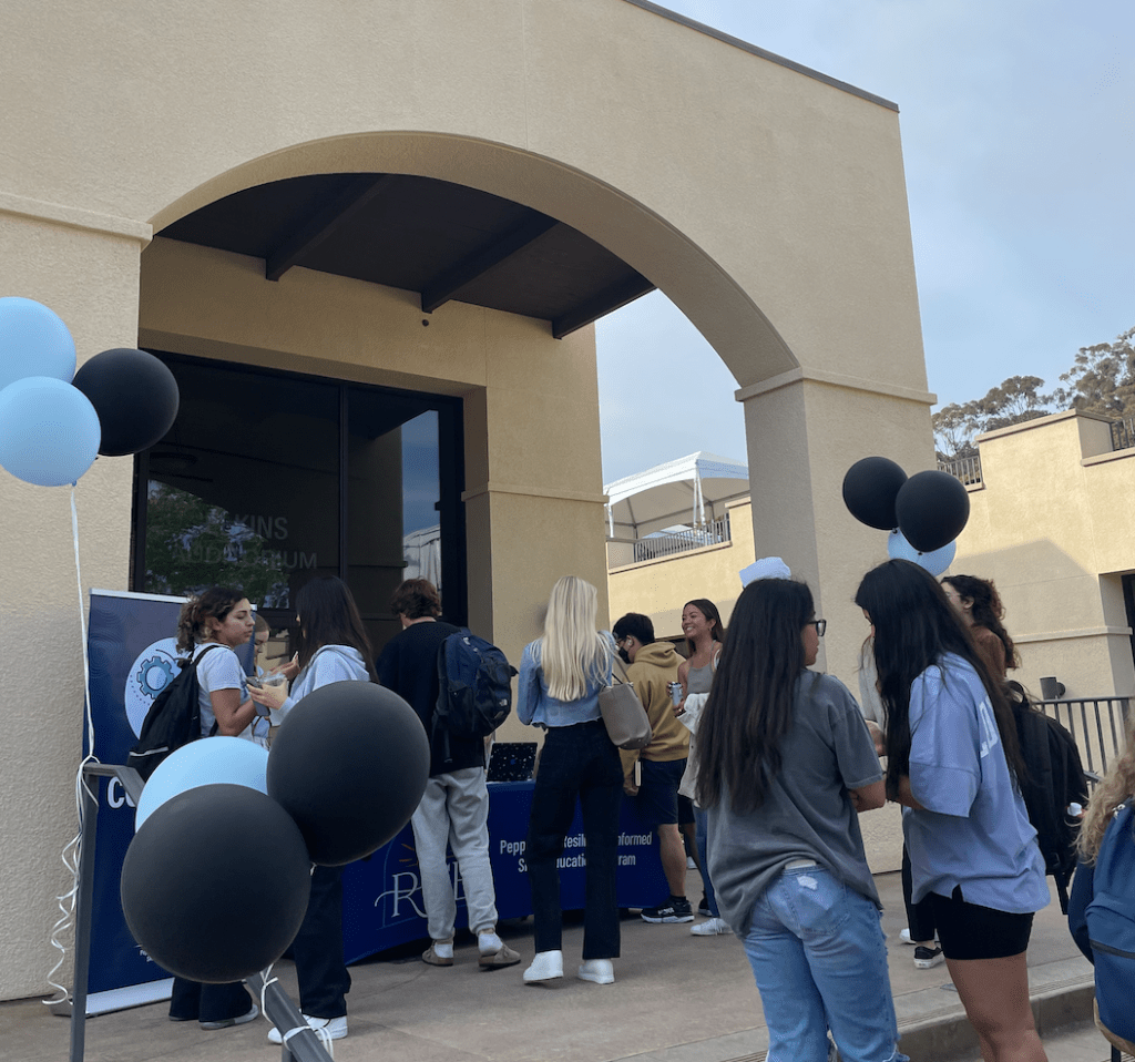 Students line up to get free RISE Summit sweatshirts and a ticket to play bingo on main campus outside of Elkins Auditorium. Horton said building community is a key factor to being resilient through difficult times.