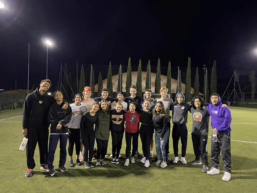 Participants of the Florence program huddle close after renting a soccer field and playing a game. Sophomore Isabella Glynn said the program also attended a professional soccer game. Photo courtesy of Isabella Glynn