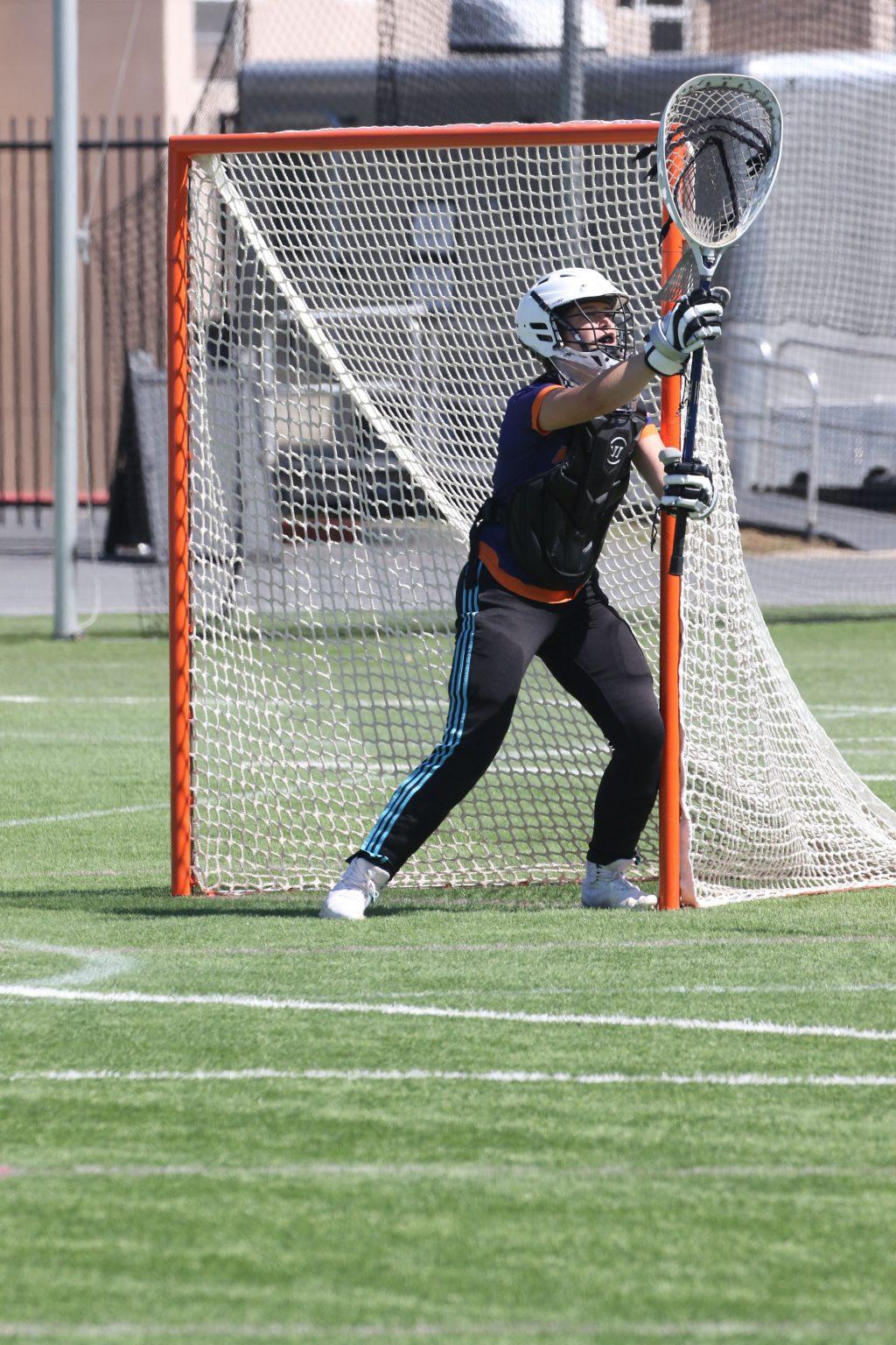 Freshman goalkeeper Kamryn Kamps makes a save during a match against Concordia in Irvine on March 27. Kamps had a career high 13 saves in the match, which the Waves won 13-8. Photo Courtesy of Pepperdine Parent