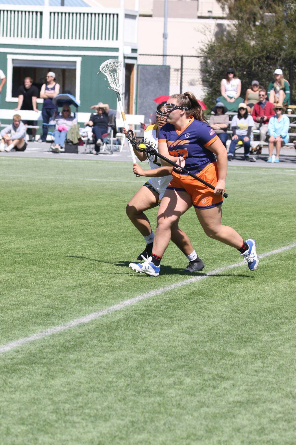 A Pepperdine player (blue jersey) battles for the ball with a Concordia player (white jersey) in their match in Irvine on March 27. The Waves were able to stay competitive in their division despite a number of challenges, Cohen said. Photo Courtesy of Pepperdine Parent