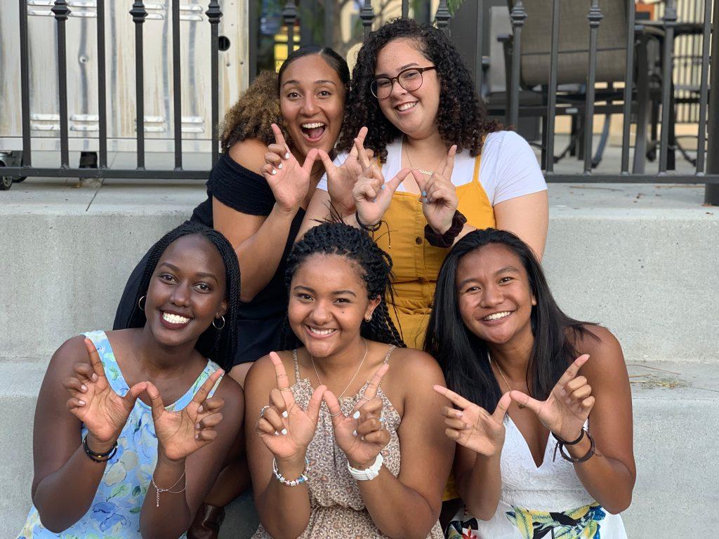 Kwizera, left front row, smiles for a picture with her 2019-20 HRL group. Kwizera said she served as an RA for two years during her time at Pepperdine. Photo courtesy of Raica Kwizera