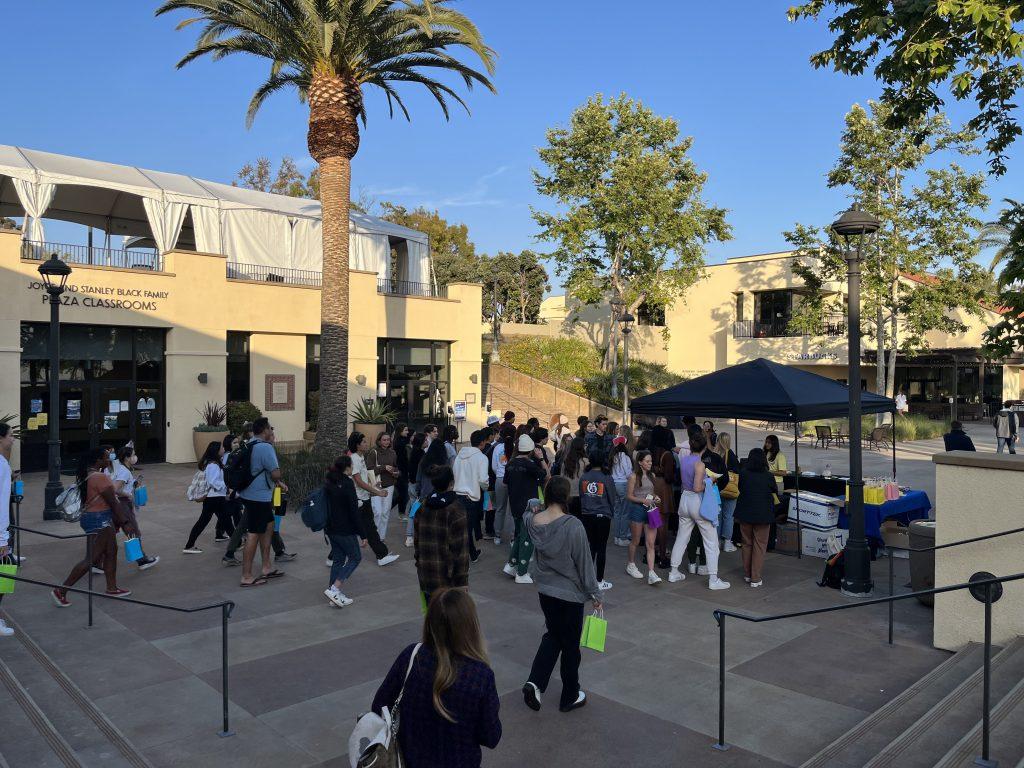 Students line up at the Songfest tent April 1 to get a ticket for free food at the food trucks for Songfest. Songfest included pre-recorded videos, food trucks and student karaoke.