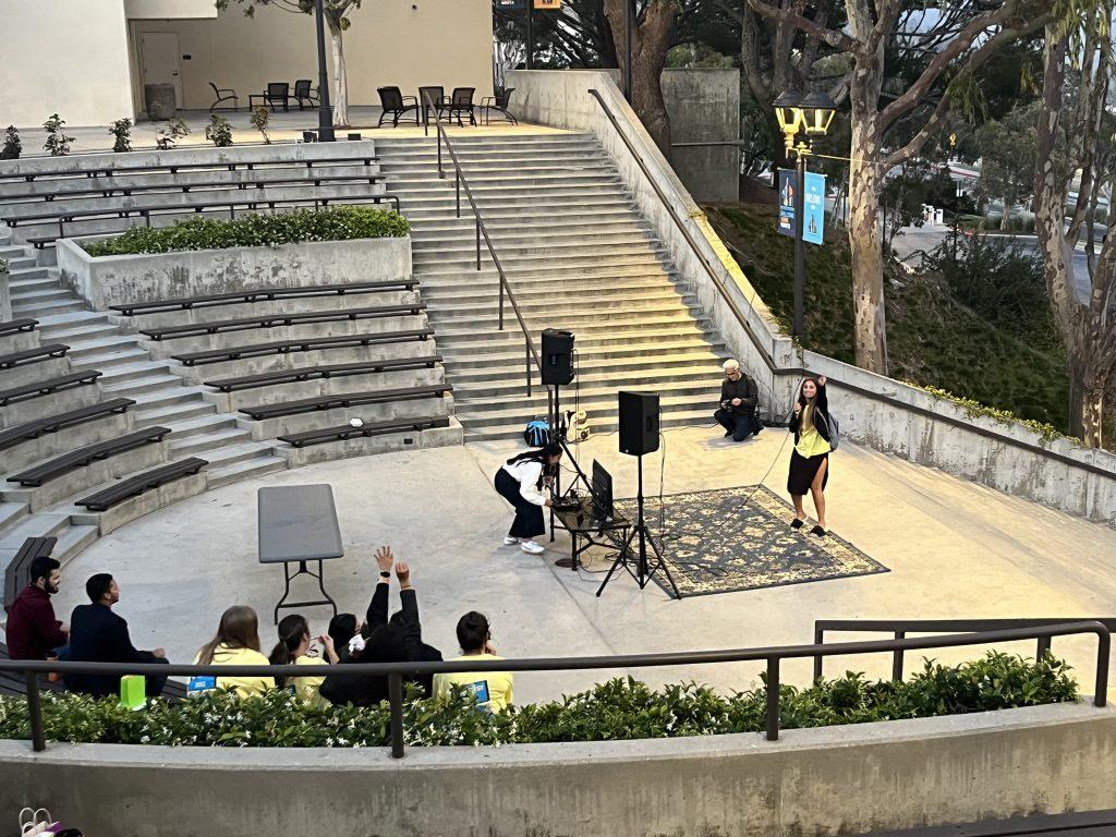 Senior Hope Dease sings "Open the Eyes of My Heart Lord" at the student karaoke portion of Songfest in the Ampitheater on April 1. Songfest consisted of pre-recorded student performances, food trucks and student karaoke.