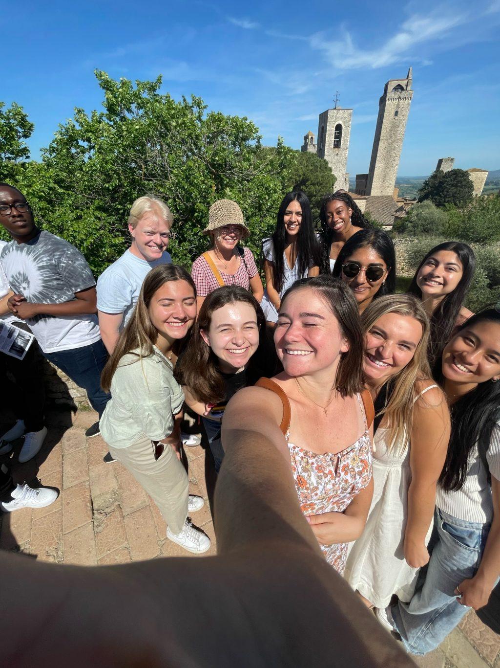 Members of the Florence May GE program take a picture in San Gimignano, Italy during a group day-excursion. The Florence program starts with a few faculty-led day-trips to show students the surrounding areas.