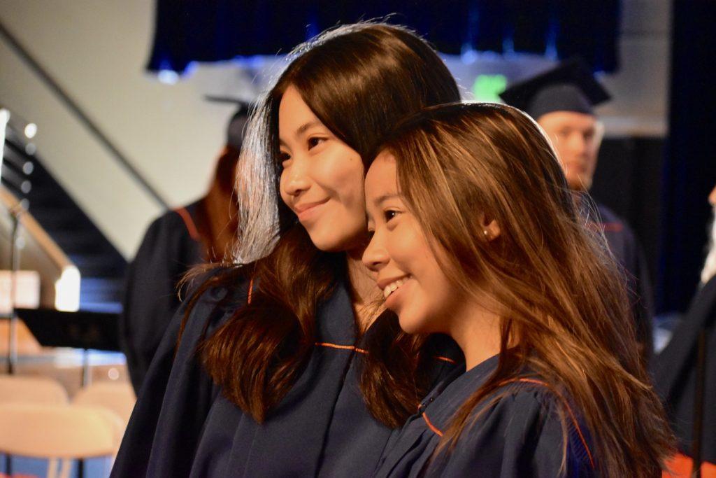 international students smile for a photo after the ceremony ended