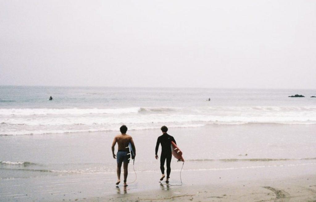 Will Noland surfs with Luke Creal in Malibu in spring 2022. Noland loved to spend time surfing and often brought his friends with him. Photo Courtesy of Will Noland's Instagram