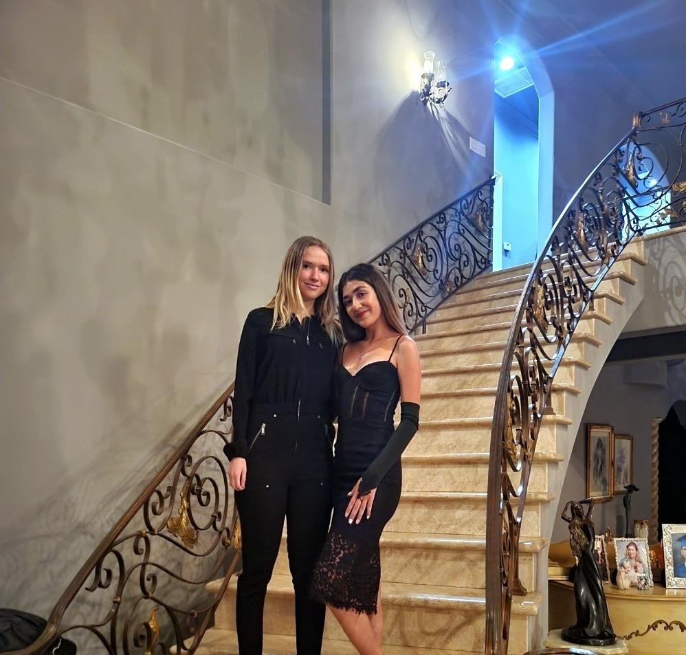 Sophomore Leilani Frailich poses at her friend's house Oct. 15. She wore her black vampire dress in front of the stairs. Photo courtesy of Leilani Frailich