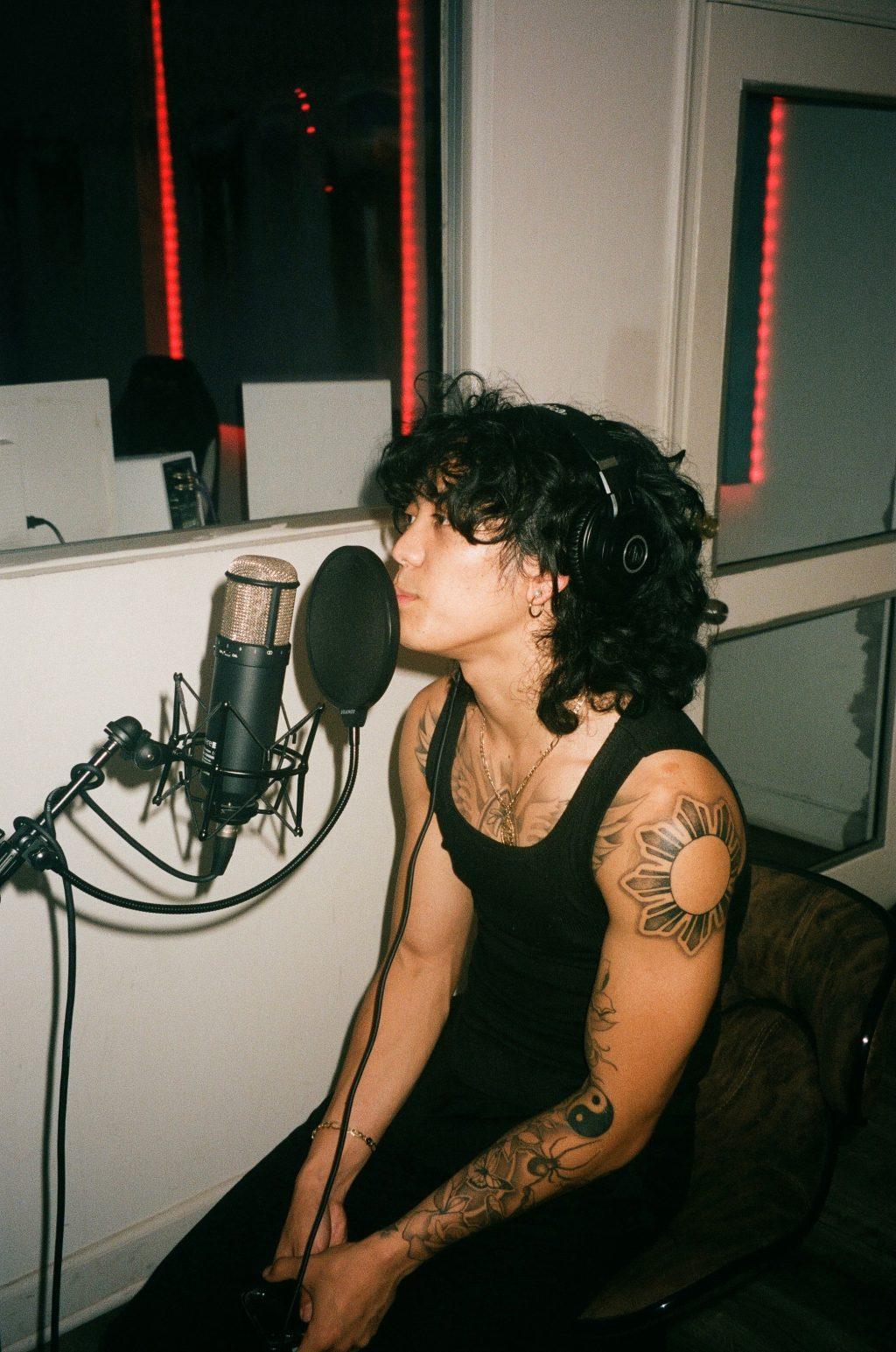 Jordan Palani waits to start recording a song in early 2022. From personal experience to outside influence, he said the studio is where his original music comes to life. Photo courtesy of Jordan Palani