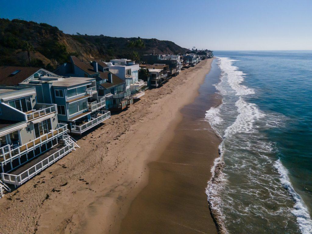Waterfront homes on Ralphs Beach face the coast in October. Grisanti said coastal retreat — the process of moving buildings inland — is more difficult in Southern California, where homes have less room to move.
