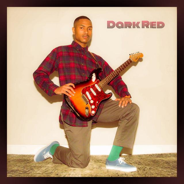Alternative artist Steve Lacy&squot;s cover for his album, "Steve Lacy&squot;s Demo," shows Lacy kneeling with an electric guitar in a red flannel. Lacy&squot;s song "Dark Red" discusses the singer&squot;s infatuation with a person they know will break their heart. Photo courtesy of RCA Records