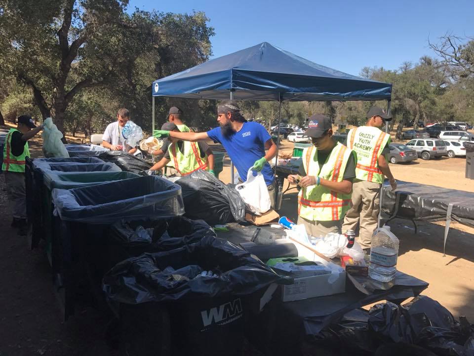 Diego Cordero, lead environmental technician at the SYCEO, organizes waste at a powwow in 2019. Romero said the SYCEO implemented zero waste practices at tribal events. Photo courtesy of the Santa Ynez Chumash Environmental Office