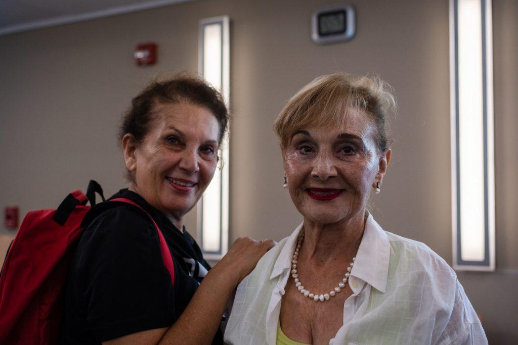 Homa Bald (left), carrying a FEMA-approved go bag, and Mimi Rose (right) smile at the camera after attending the emergency preparedness event at the Malibu Senior Center on Sept. 28. Bald and Mimi are sisters from Santa Monica and Malibu, respectively, and said they came to the meeting to learn how to prepare for emergency situations such as wildfires. Photo by Lucian Himes
