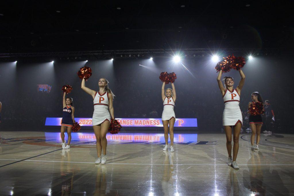 The cheer team performs at Blue and Orange Madness on Oct. 14. The step team, RnD dance crew and Won by One also performed. Photo by Chloe Chan
