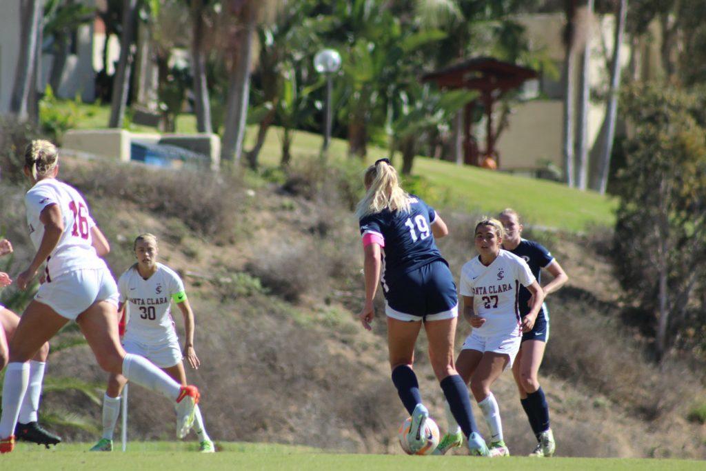 Senior midfielder Carlee Giammona dribbles through the Broncos' defense at Tari Frahm Rokus Field on Oct. 5. The Waves lone goal was scored on a free kick — in which Giammona helped with drawing the foul.