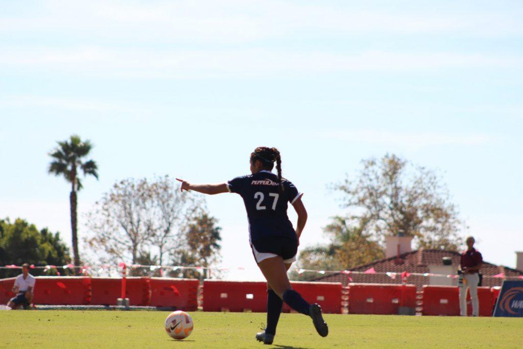 Freshman midfielder Karina Gonzalez dribbles the ball versus Santa Clara at Tari Frahm Rokus Field on Oct. 5. The Waves and Broncos both tied with shots on goal with four apiece.