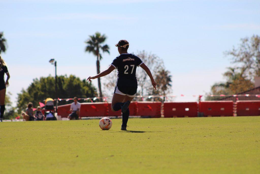 Romero looks for an open teammate versus Santa Clara at Tari Frahm Rokus Field on Oct. 5. The Waves had six offsides compared to the Broncos' three.