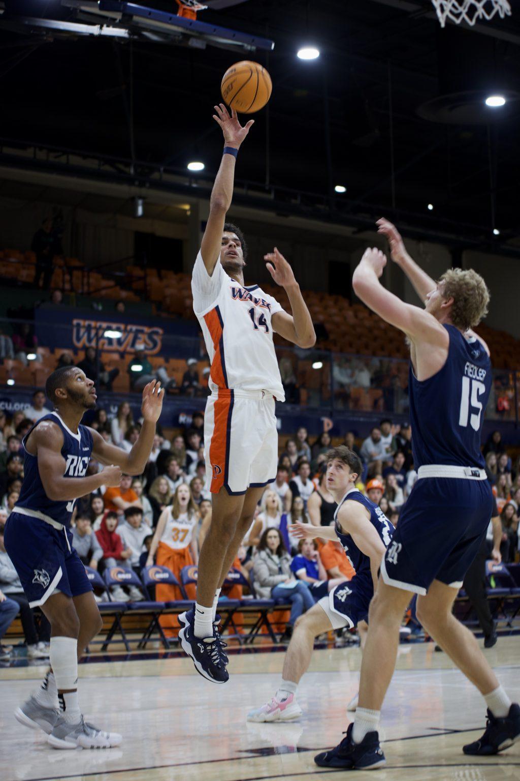 First-year forward Jevon Porter goes up for a layup versus Rice on Nov. 7 at Firestone Fieldhouse. Porter finished with 16 points in his collegiate debut.