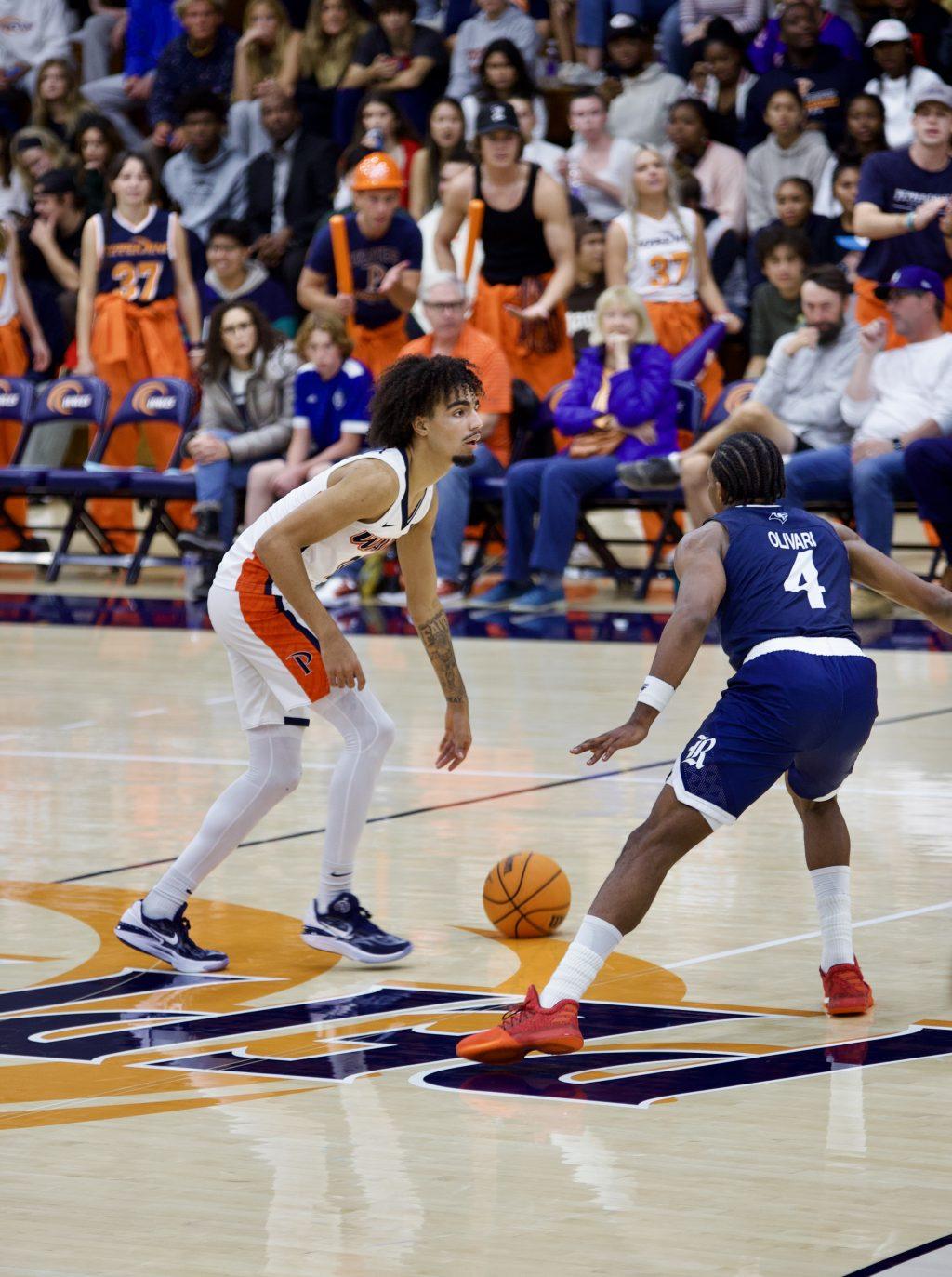 Sophomore guard Houston Mallette brings up the ball versus Rice on Nov. 7 at Firestone Fieldhouse. Mallette said the team responded well to adversity and stuck together.