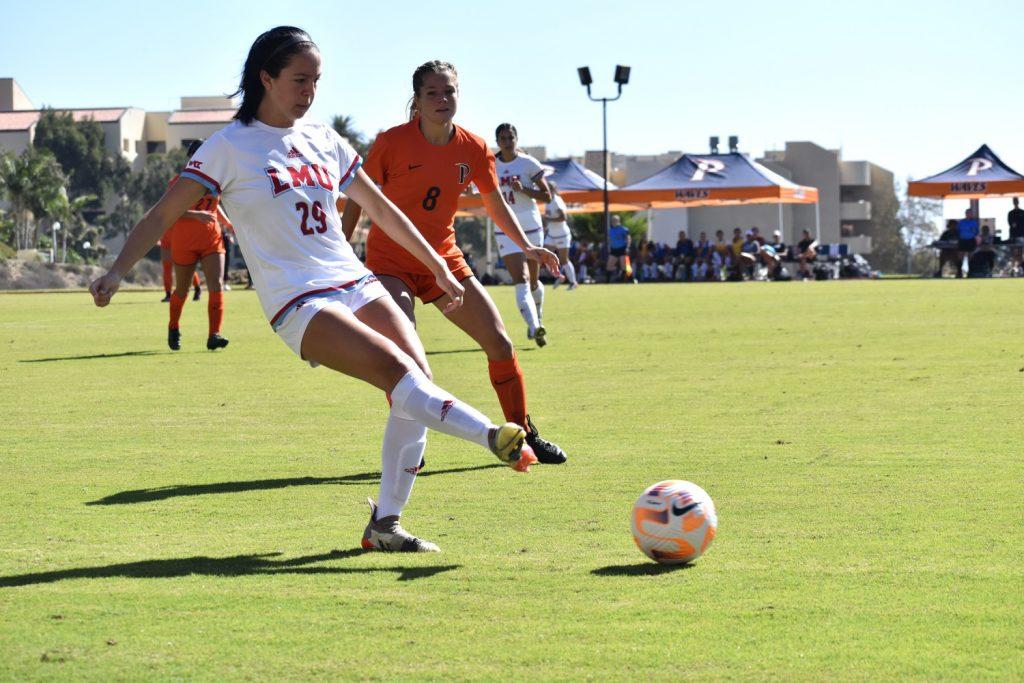 Pepperdine Women's Soccer senior midfielder Shelby Little (No. 8) rushes to defend LMU sophomore midfielder Sophia Pearlman on Oct. 29 at Tari Frahm Rokus Field. The Waves struggled as of late but gained much needed victories versus Pacific and LMU.