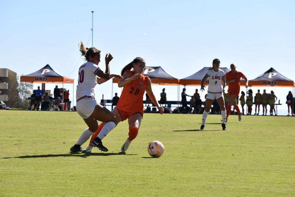 Freshman midfielder Tatum Wynalda zips past her defender Oct. 29 at Tari Frahm Rokus Field. The Waves seemed to found their offensive rhythm — scoring eight goals in the past three games — once again with strong performances versus Pacific and LMU.