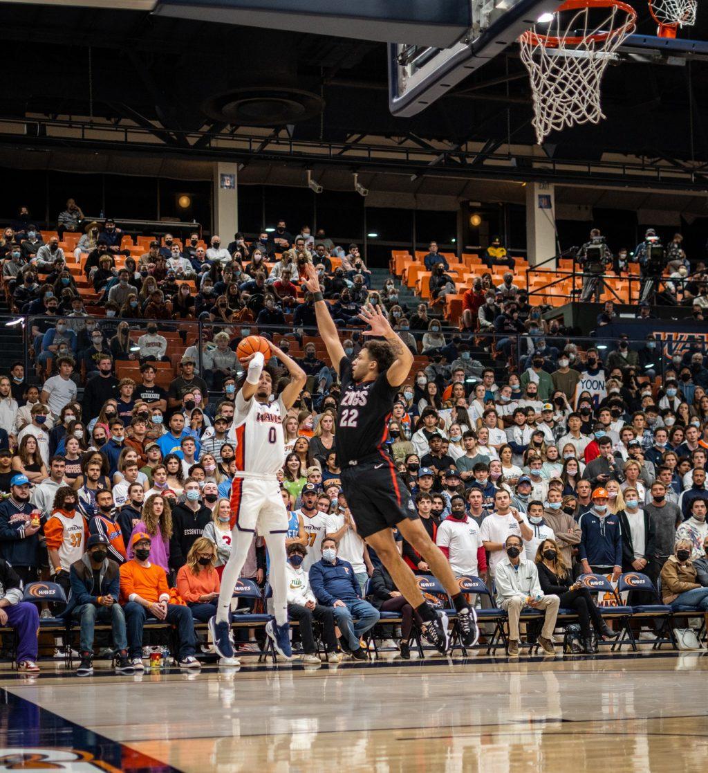 Then-first-year Houston Mallette shoots a corner 3-pointer versus Gonzaga on Feb. 16, 2021 at Firestone Fieldhouse. Mallette broke the first year record of 3-pointers made with 71 3-pointers, according to Pepperdine Athletics.