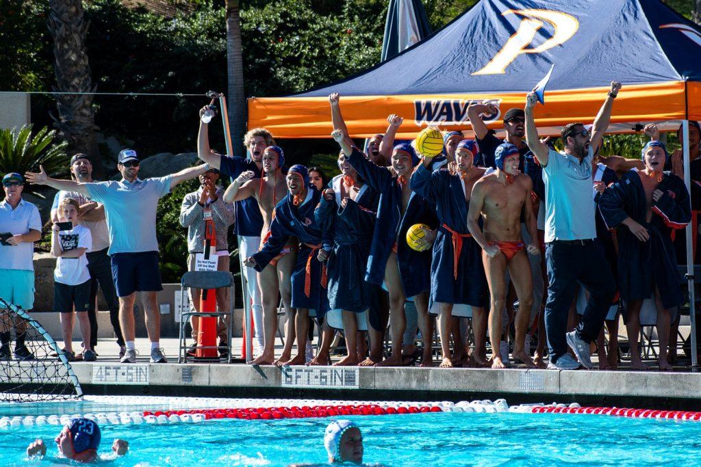 team celebrates after winning block