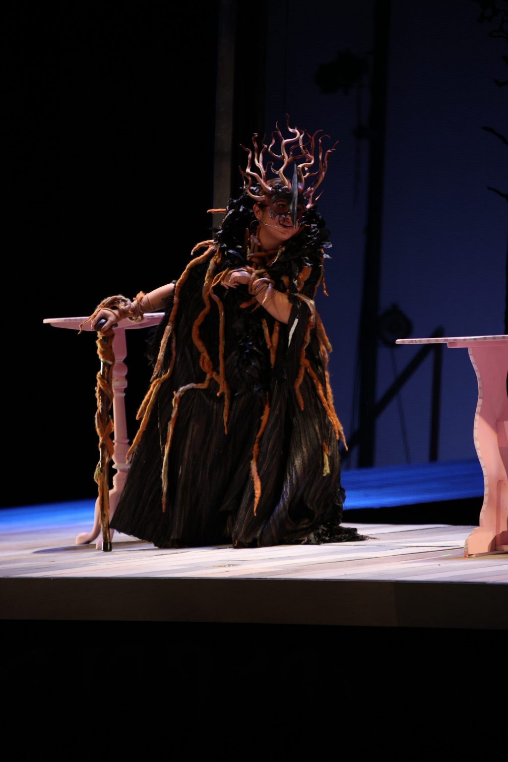 Senior Madison Sprague plays the evil witch who terrorizes the baker and his wife as she casts a spell during dress rehearsal Wednesday, Nov. 9. The witch sang of sadness and loss of her garden. Photo courtesy of Lucian Himes