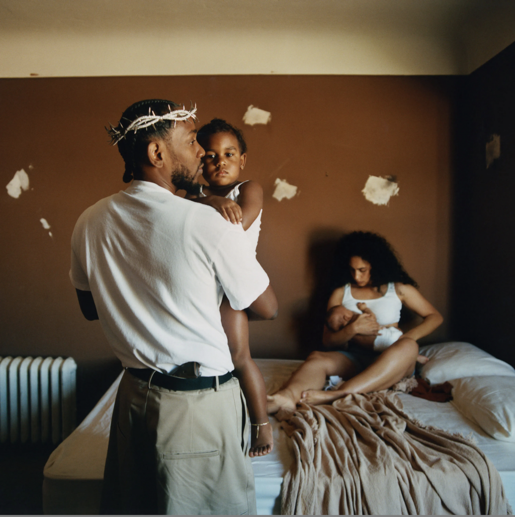 Rapper Kendrick Lamar stands with child in arms while wearing a crown of thorns on the album cover for "Mr. Morale & The Big Steppers." This poignant imagery of biblical allusion is just an ounce of Lamar&squot;s intricate artistry that so many admire today. Photo Courtesy of oklama.com