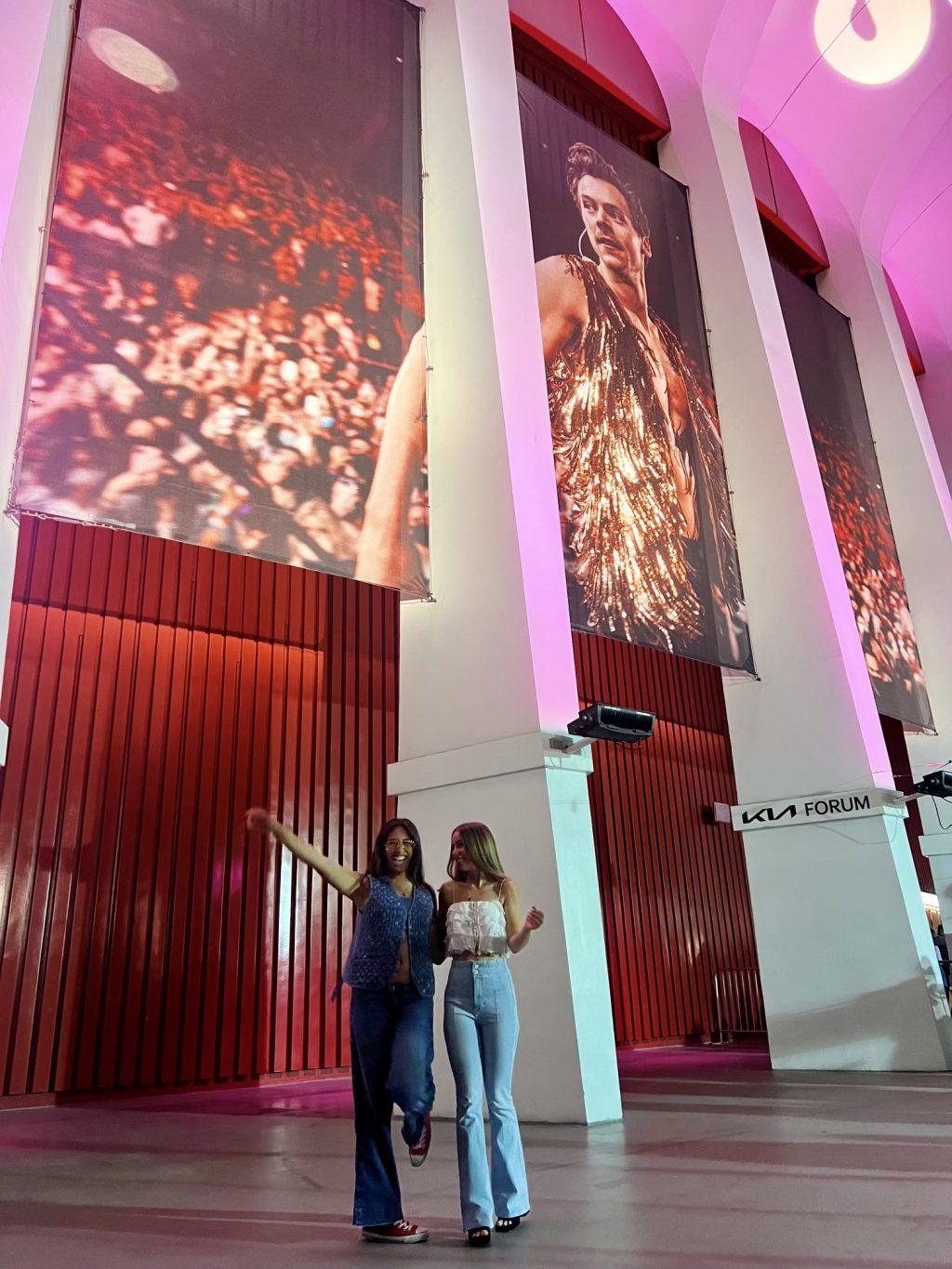 Sophomores Lauren Brajevich and Jordan Solofa get ready for Harry's House on Oct. 28. Brajevich said observing the fashion at the show made the experience even better. Photo courtesy of Lauren Brajevich