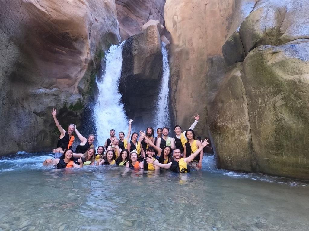 Jordan program participants in the Wadi Mujib, a river in Jordan, in summer 2022. Students and faculty traveled throughout the week and on the weekends.