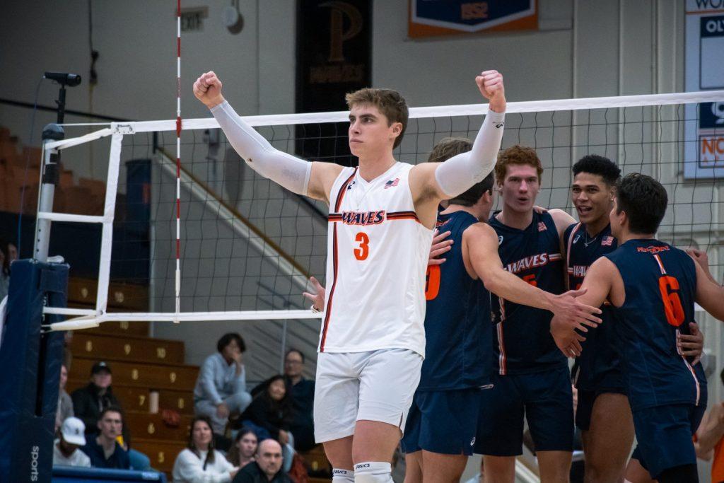 Junior libero Trey Cole celebrates after the Waves score against Princeton on Jan. 16, at Firestone Fieldhouse. Cole said the reason behind the team's offensive prowess is the hitters on the team — they can touch heights a lot of guys can't.