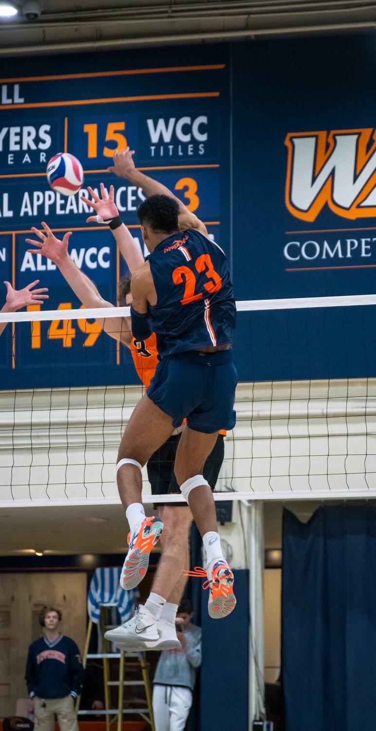 Men's Volleyball graduate outside hitter Jaylen Jasper rises for a kill versus Princeton on Jan. 16, at Firestone Fieldhouse. Jasper came back to Pepperdine by using the extra year of eligibility due to COVID-19, according to Pepperdine Athletics.