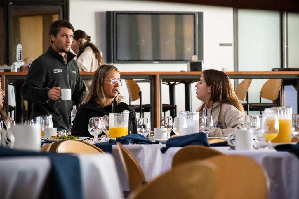 New students get to know each other over breakfast in the caf.