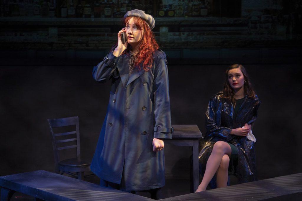Jean listens to a phone call on Gordon's phone as The Other Woman, played by Luca Nicoletti, watches in the shadows Jan. 24, in Lindhurst Theatre. Nicoletti said she was excited by the challenge of playing a powerful character.