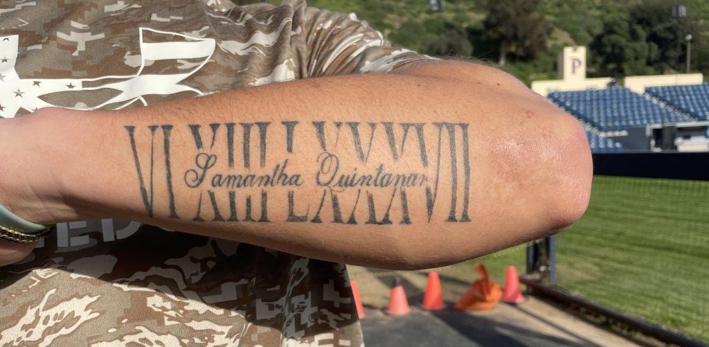 Freshman Baseball catcher Matt Quintanar shows a tattoo on his left forearm at Eddy D. Field on Jan. 18. His tattoo represents June 13, 1987, the birthdate of Matt's sister Samanatha. Quintanar saw his older sister as a role model and aspires to follow in her hardworking footsteps. Photo by Alex Clarke