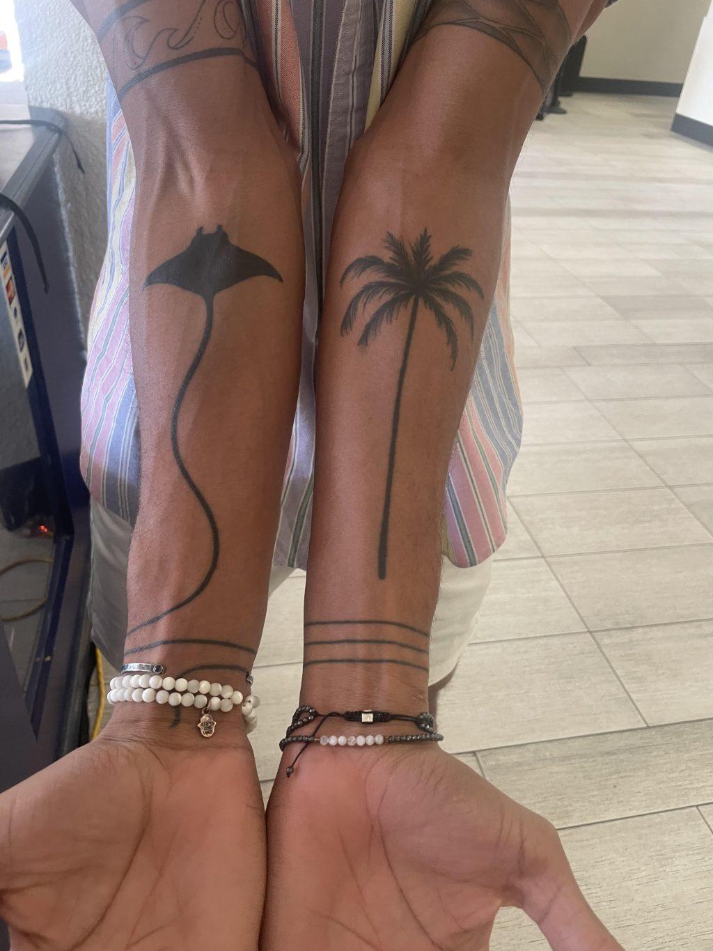 Graduate Outside hitter Jaylen Jasper shows off his forearm tattoos. Pictured here he has a manta ray tattoo, representing an important donation that Jasper made as an undergraduate. Photo by Alex Clarke