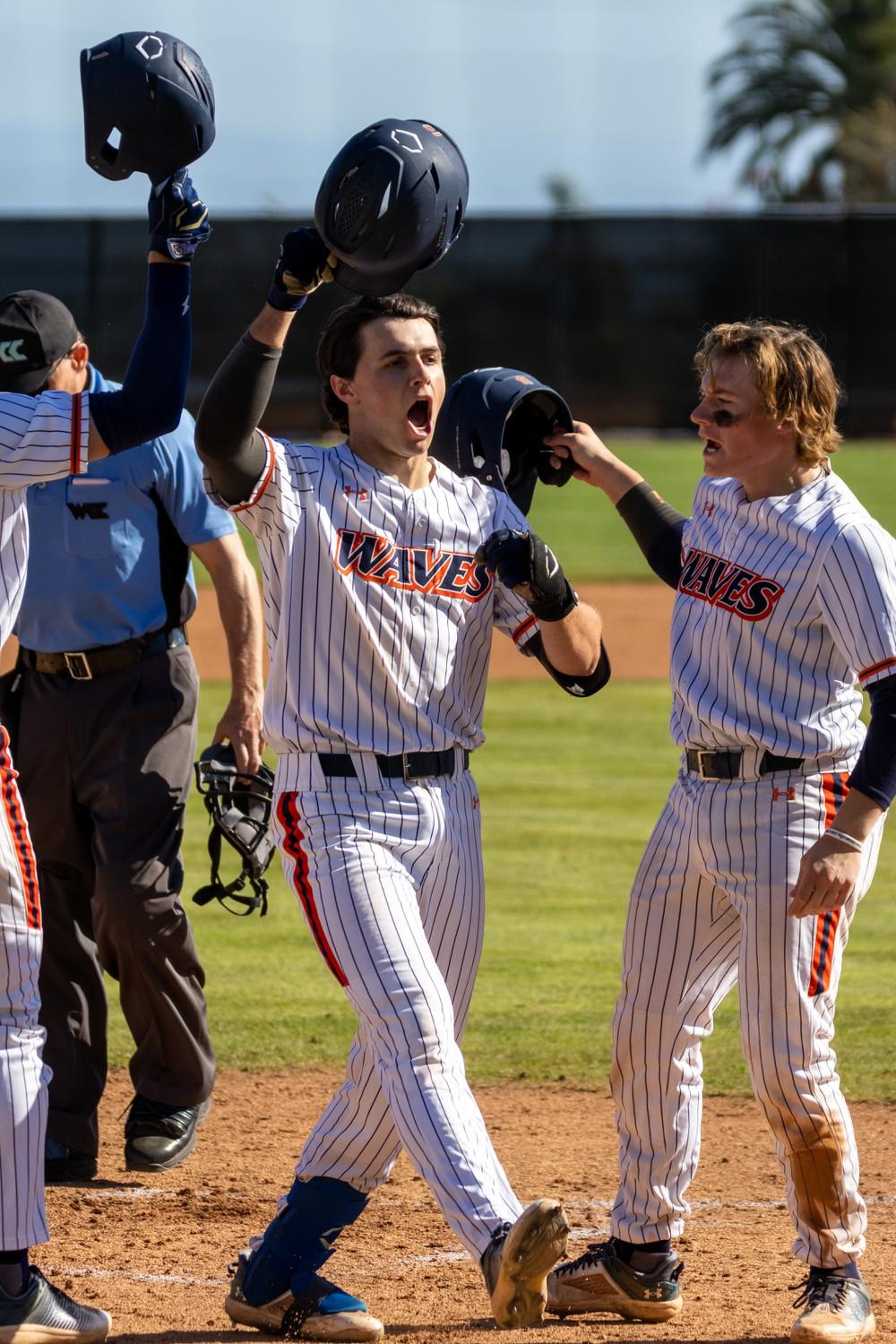 The Waves celebrate after scoring a run against Gonzaga on March 24-25, at Eddy D. Field Stadium. They scored 15 runs in the first game of the series.