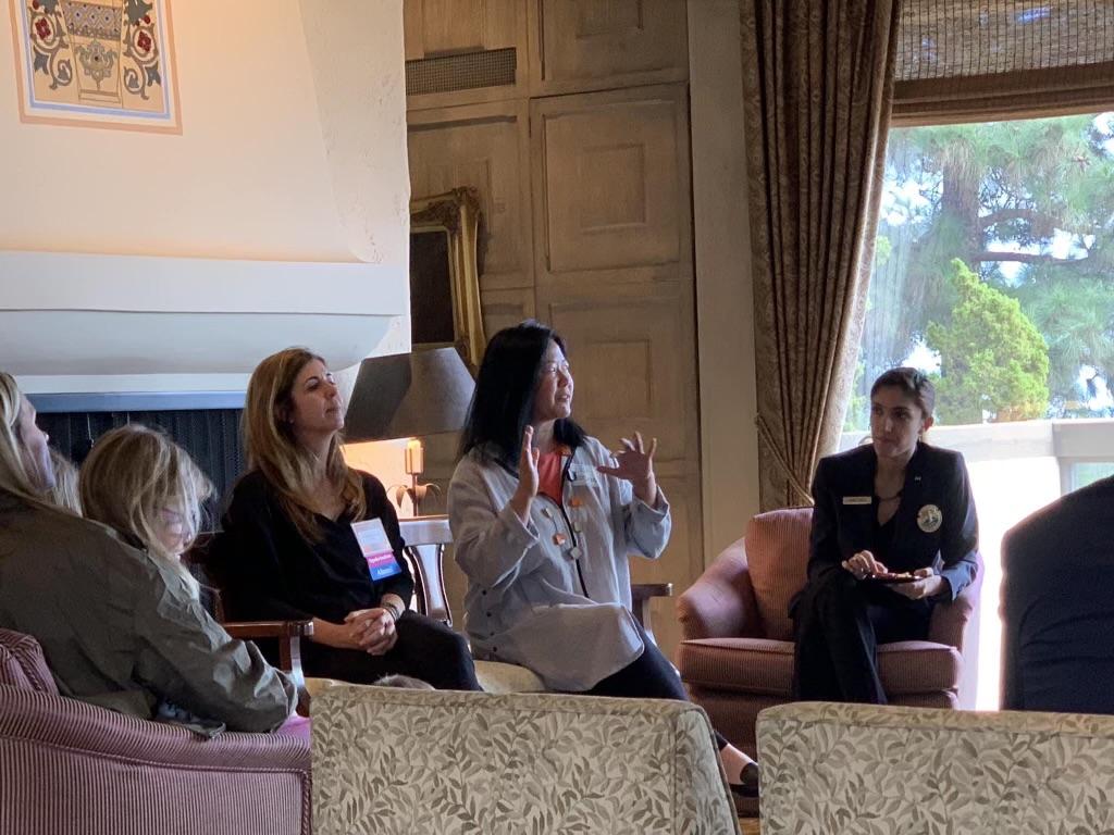 Christine Grimm, Seaver alumna (‘90) and founding chairperson of PAC, speaks with Lisa Kodama, Seaver alumna (‘89) and GSEP alumna (‘91) and PAC co-founder, at the 29-year PAC reunion at President Benton's house in his last year as president. Grimm and Kodama said they created PAC to fill a space at Pepperdine. Photo courtesy of Christine Grimm