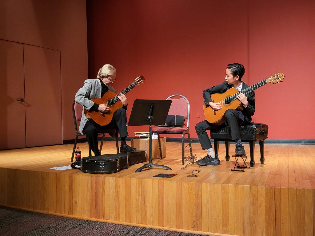 Parkening performs with a student at the masterclass Feb. 18. Parkening's masterclass consisted of performances and musical critics. Photo courtesy of Christopher Parkening