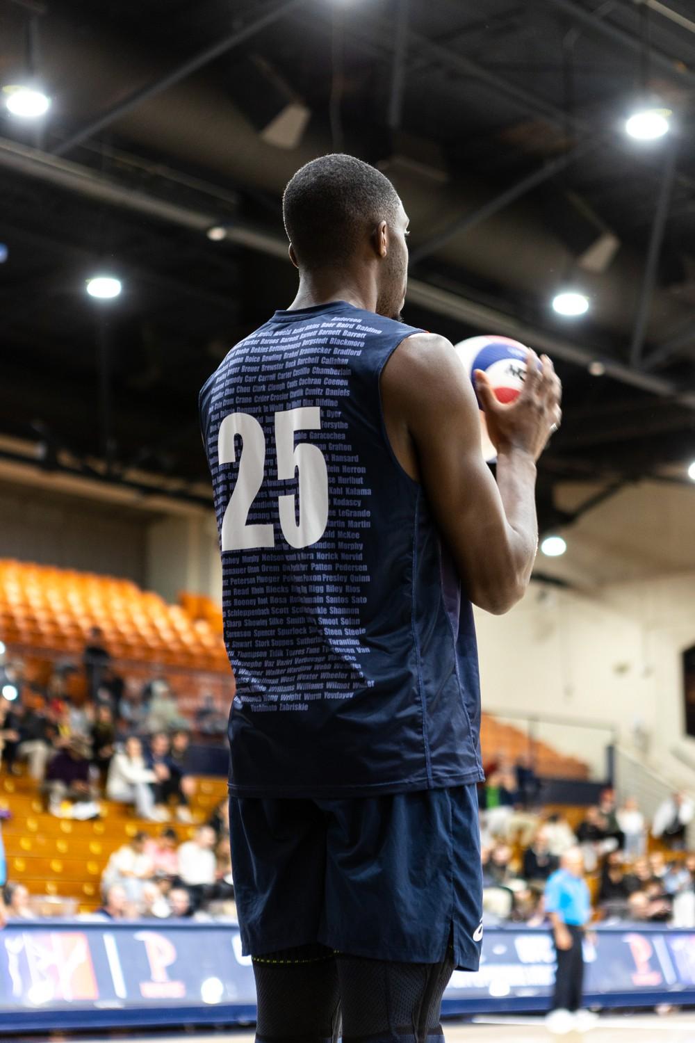 Senior outside hitter Akin Akinumi prepares to serve in a game against USC on March 9, at Firestone Fieldhouse. The Waves said they focused on serving during this game.