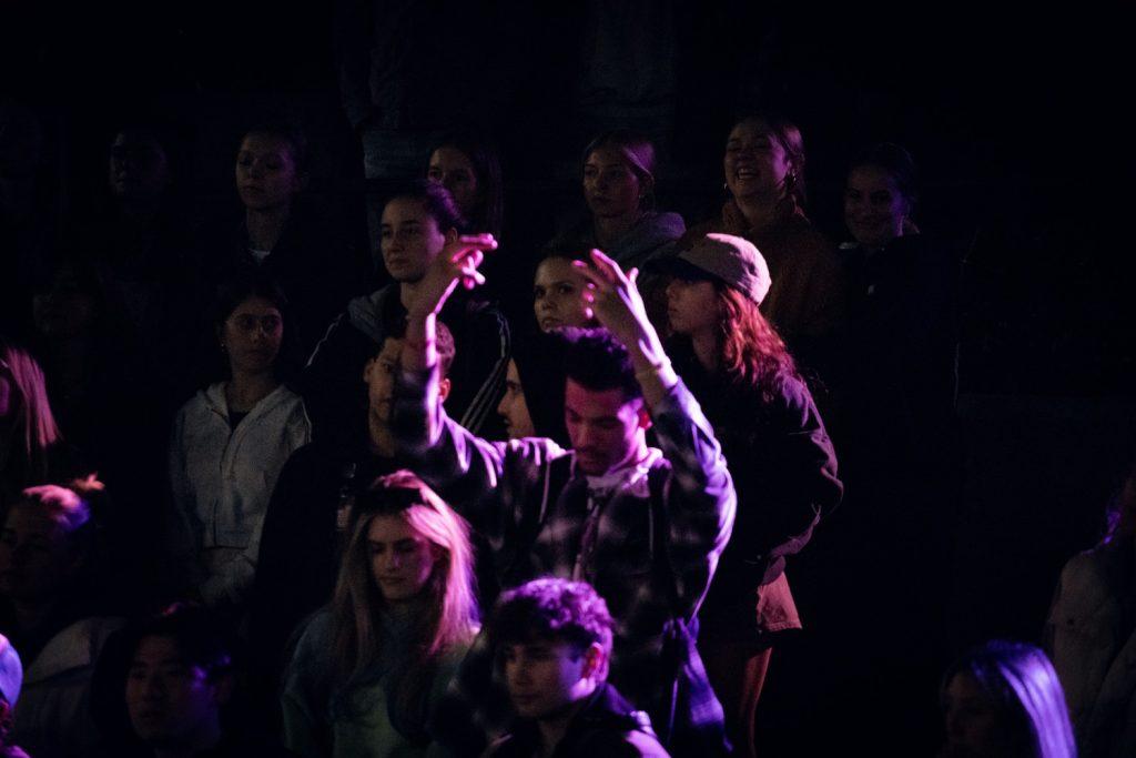 A student raises his hands in prayer during The Well on Feb. 16. The Well provides an opportunity for those of all faiths and those seeking to explore their faith to come together, according to their Instagram page.