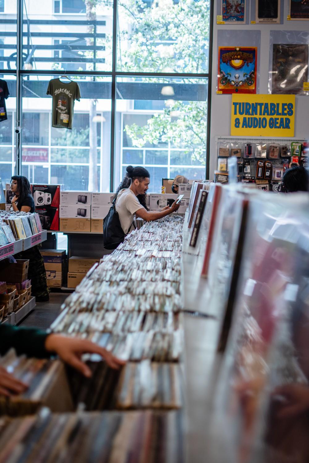 Customers at Amobea search for records.