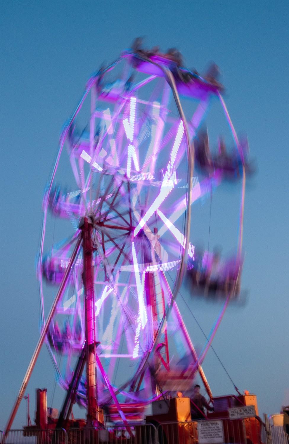 The Ferris wheel spins on Alumni Park for PSMA on March 25. Students said they enjoyed music, food and art during the festival. Photo by Sammie Wuensche