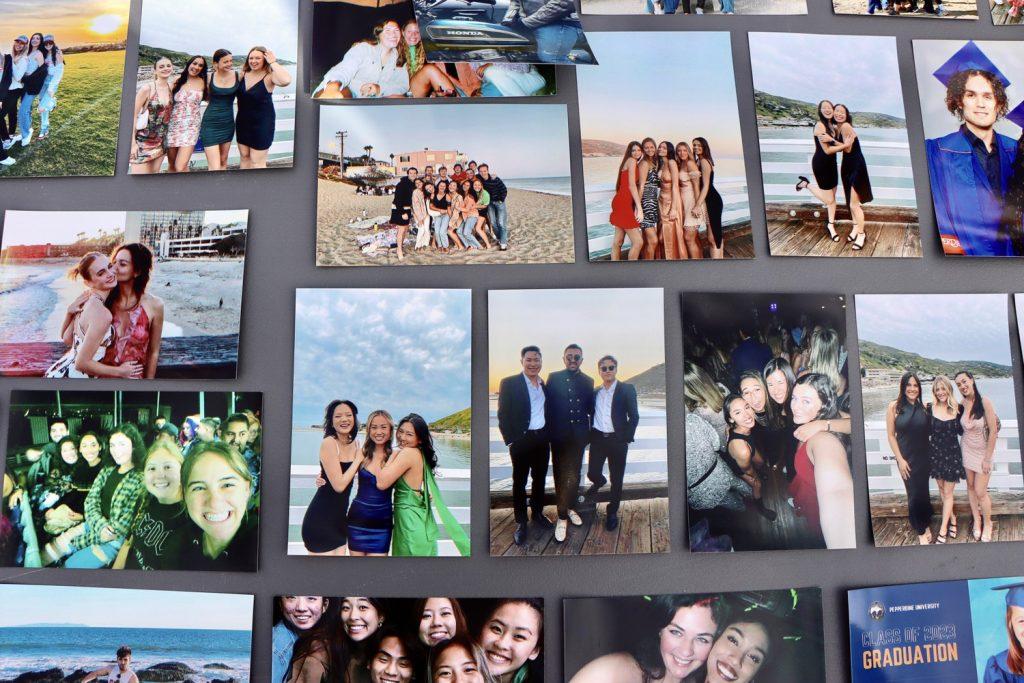 Pictures of seniors are laid out on the tables at Senior Sunset on April 7. Seniors had the opportunity to send in pictures to the Board prior to the event for students to pick up.